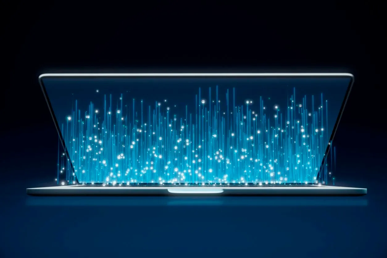 Futuristic laptop with glowing blue data streams